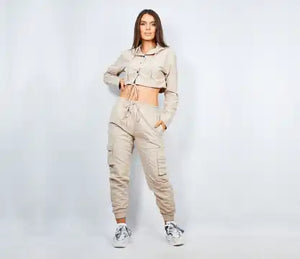 Woman’s beige crop top and cargo pants outfit.